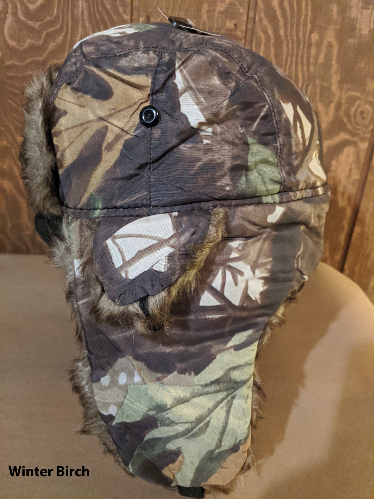 Winter cap with ear coverings - trapper hat