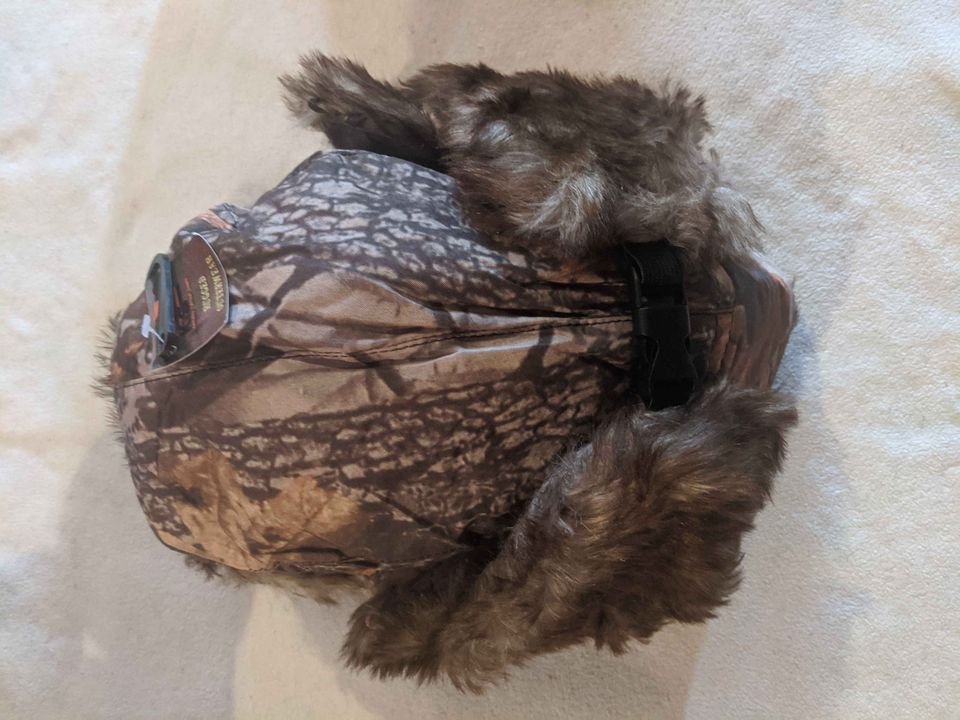 Winter cap with ear coverings - trapper hat