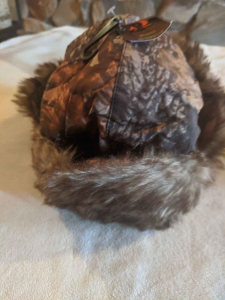 Winter cap with ear coverings - trapper hat