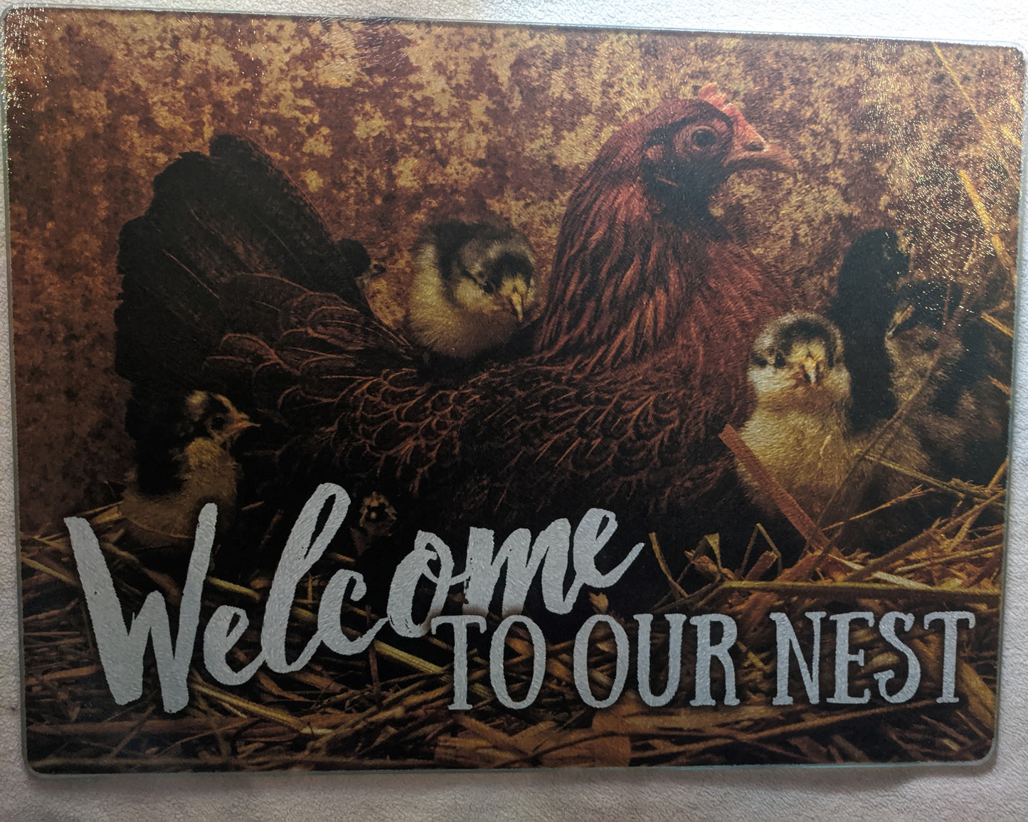 Welcome to our Nest Hen & Chicks Tempered Glass Cutting Board 12"x16"