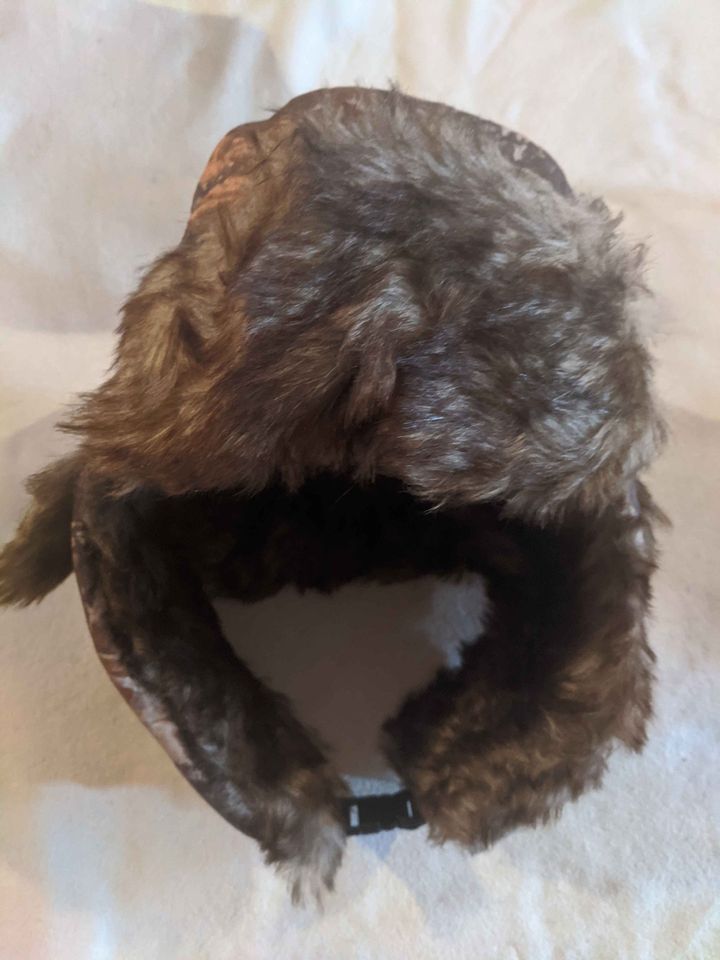 Winter cap with ear coverings - trapper hat