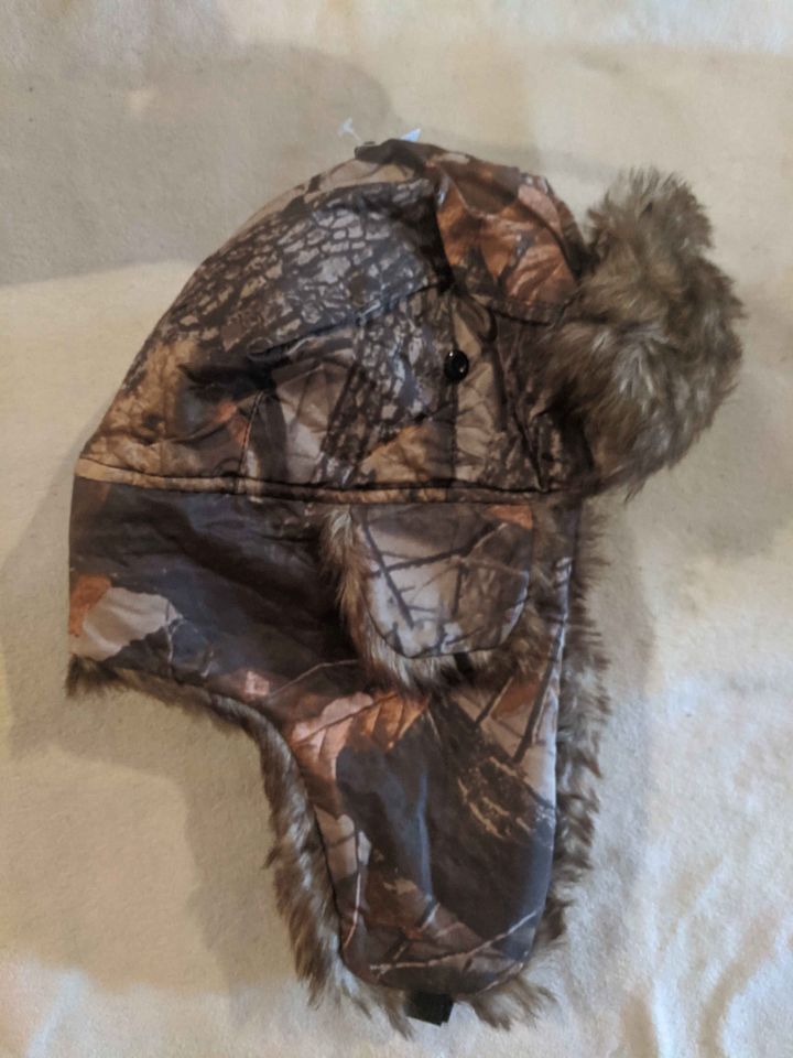 Winter cap with ear coverings - trapper hat